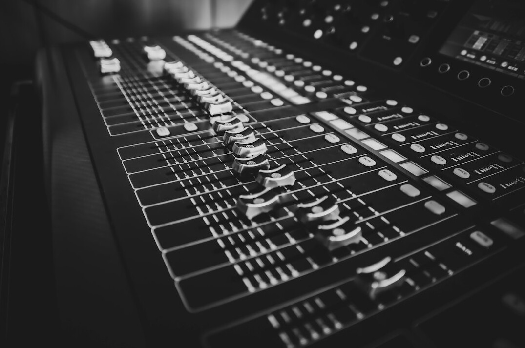 Production control room with multiple monitors and vision mixer