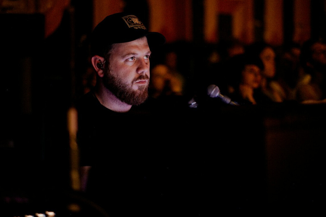 Portrait of a bearded man in his forties, sound engineer